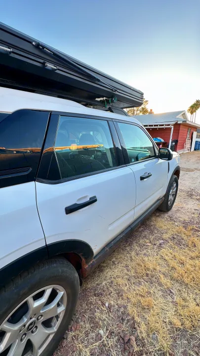 White Ford Bronco Sport with a rooftop tent, great for an rv rental camping adventure.. Ford Bronco sport 2022