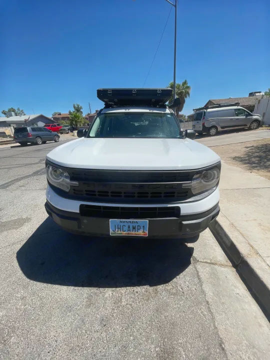 White Ford Bronco Sport with rooftop tent, perfect for an RV rental adventure.. Ford Bronco sport 2022