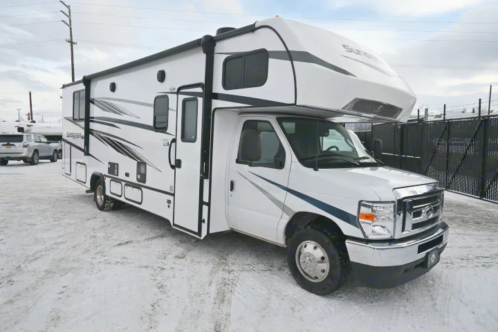 White Sunseeker Class C RV rental, built on a Ford chassis, parked on a snowy lot.. Forest River Sunseeker - LE Series M-2850S 2024