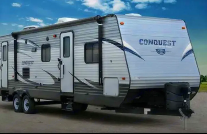 Get ready for adventure with this Conquest travel trailer RV rental. Ideal for camping and outdoor trips.. Gulf Stream Conquest 2017