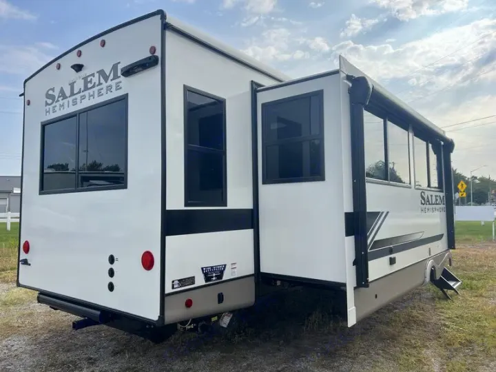 Rear view of a white Salem Hemisphere travel trailer RV with an extended slide-out. Ideal for your next rv rental.. Forest River Salem Hemisphere 2024