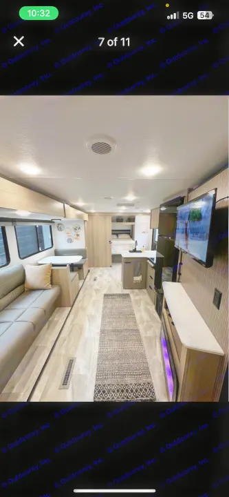 Spacious rv rental interior featuring a sofa, dinette, kitchen, and bedroom. Modern design with bright lighting.. Dutchmen Kodiak SE 2024