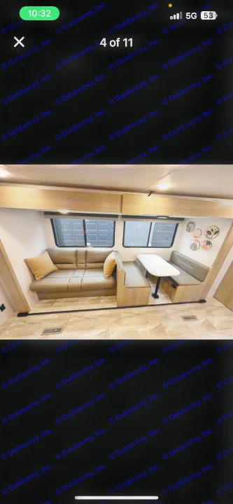 RV rental interior: modern and clean living space with a comfy couch, a dinette table, and ample seating.. Dutchmen Kodiak SE 2024
