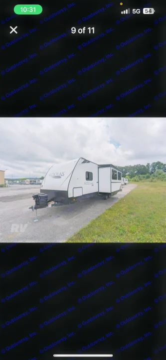 White Kodiak RV rental travel trailer, parked on asphalt. Ideal for outdoor adventures & road trips.. Dutchmen Kodiak SE 2024