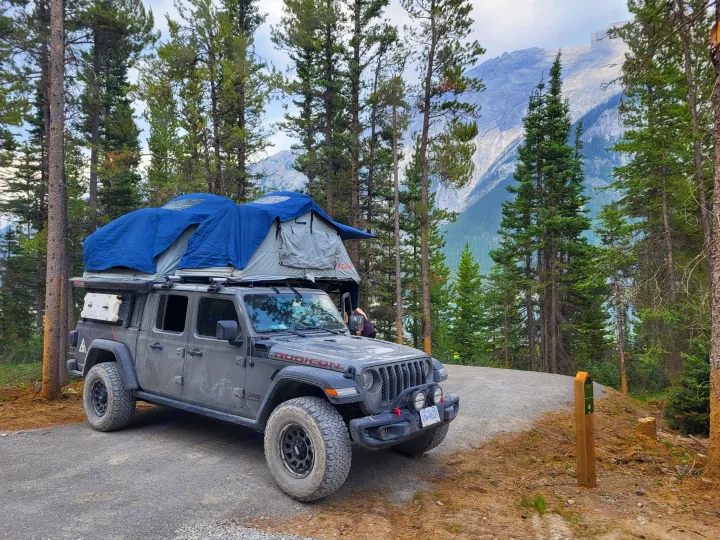 Adventure-ready Jeep Gladiator with rooftop tents, offering an RV rental alternative for mountain camping.. Jeep Gladiator 2021