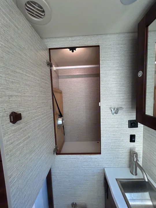 Closet located in Bathroom.. Winnebago Navion 2022