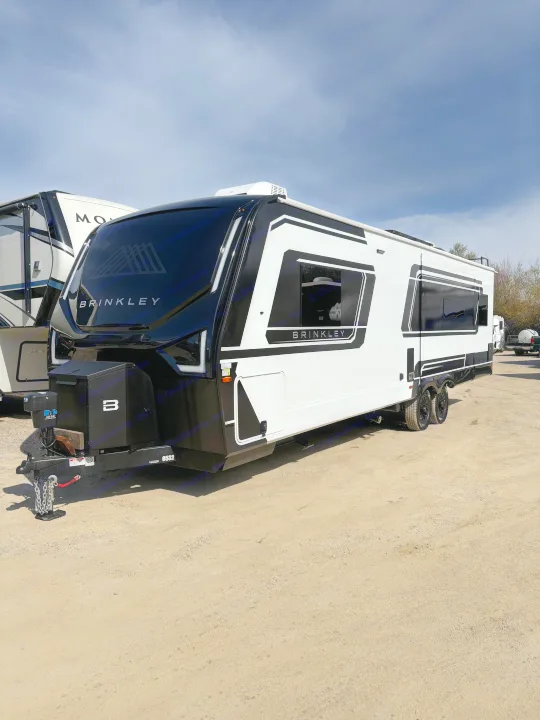 Modern black and white Brinkley travel trailer, ideal for your next rv rental adventure.. Brinkley 295 AIR 2025