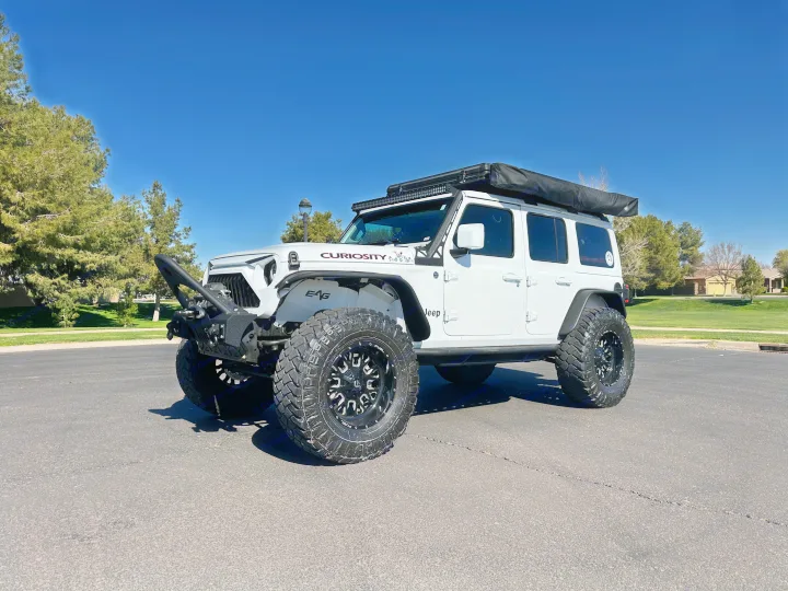 This white 'Curiosity' Jeep Wrangler, modified for overlanding, offers a unique alternative to an RV rental for your next adventure.. Jeep Overlander 2019