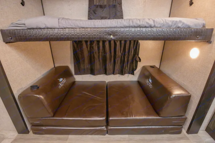 RV rental bunk room: upper bed, two Jayco folding beds with cup holders, & a window with dark curtains.. Jayco Jayflight 32BHDS.G 2022