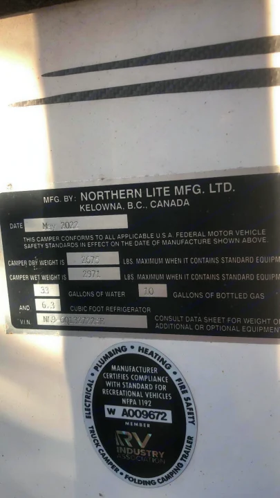 RV rental: This camper manufacturing label shows dry (2675 lbs) & wet (2971 lbs) weights, plus water & gas capacities. Key RV specs.. Northern Lite 9-6 Wet Bath 2022