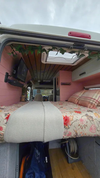Step inside a vibrant rv rental: custom pink interior, comfy bed, TV, and skylight for your adventure.. Citroen Relay L3H2