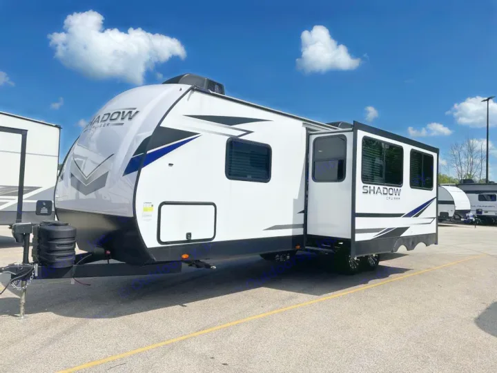 White Shadow Cruiser RV travel trailer, parked outdoors with expanded side, ideal for your next RV rental trip.. Cruiser RV Shadow Cruiser 2025