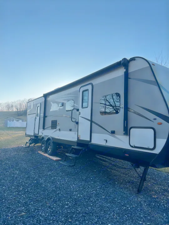 Spacious Jayco RV rental parked on gravel with steps down, ready for your next outdoor adventure.. Jayco Jay Flight 2018