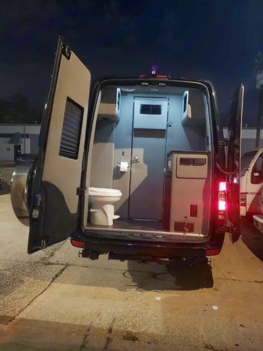 Explore this RV rental's mobile toilet inside a converted van, perfect for on-the-go convenience.. Midwest Automotive Designs Midwest Automotive Designs Class B 2016