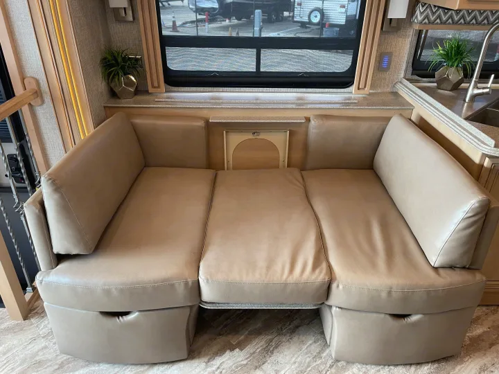 Modern RV rental interior with a comfortable, convertible sofa-bed and a view outside.. Canyon Star Canyon Star Motorhome 2020