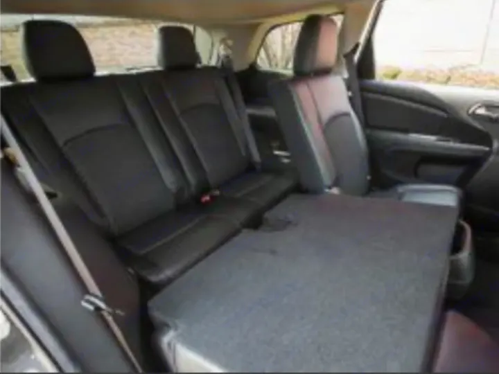 RV rental interior shows versatile seating with rear seats folded flat for cargo space.. Dodge Journey 2016