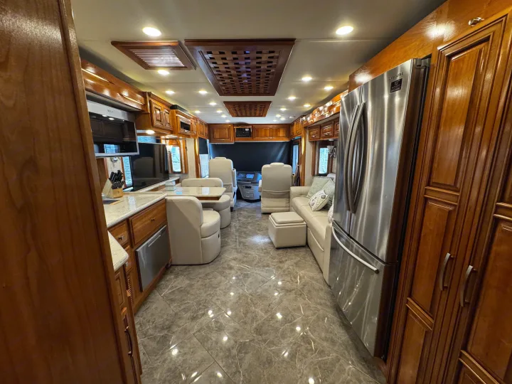 Explore this luxurious RV rental's spacious interior: full kitchen, elegant dining, comfy living area, and modern finishes.. New Aire New Aire Motorhome 2020