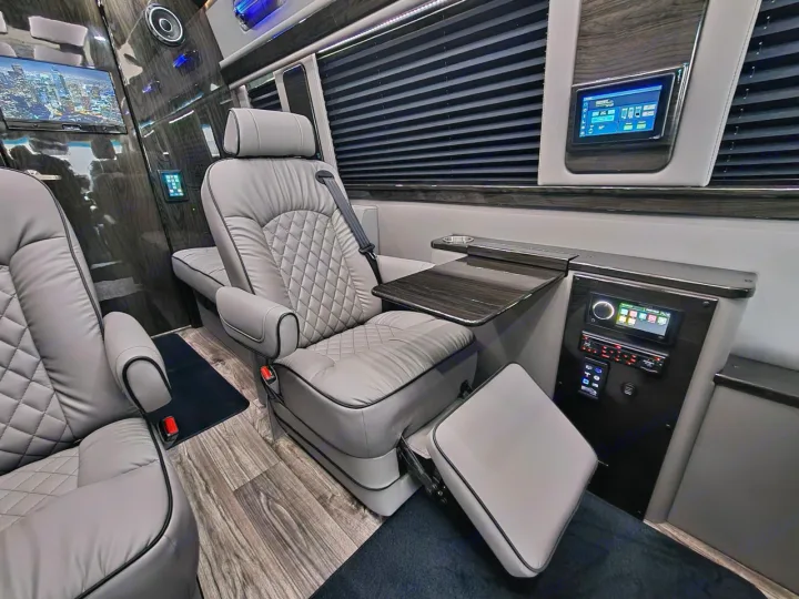 Luxury RV rental interior with plush seating, entertainment screens, and custom finishes.. Ultimate Toys Ultimate Coach 2026