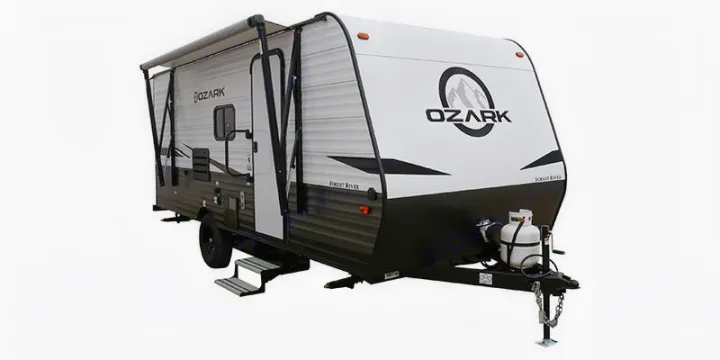 White & black Ozark travel trailer with extended awning & propane tank, perfect for your next RV rental adventure.. Ozark Lite 2021