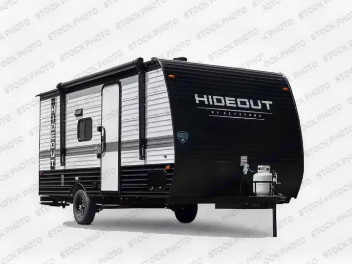 Black and white Keystone Hideout travel trailer, an excellent choice for your next RV rental and outdoor adventure.. Keystone RV Hideout Sport 2024