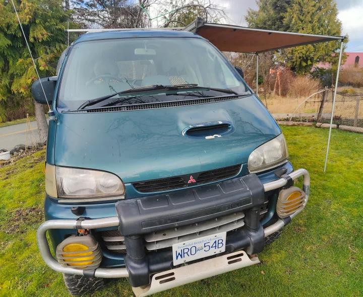 RV rental: Green Mitsubishi Delica 4x4 van with awning & bull bar, ready for adventure.. MITSUBISHI Delica 1997