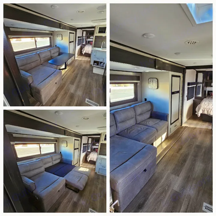 Inside a comfortable RV rental: living area with convertible sofa/bed, dining table, kitchen, and rear sleeping area.. Jayco Jay Feather 2021