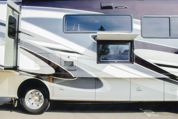 This modern RV rental, featuring a striking black, grey, and white design, offers an outdoor TV, multiple windows, and storage.. Allegro Allegro Open Road 2021