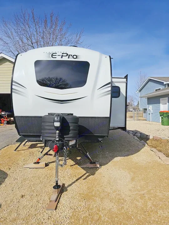 Front view: white Flagstaff E-Pro travel trailer, perfect for rv rental, parked on gravel. Ready for camping!. Forest River Flagstaff E-Pro 2024