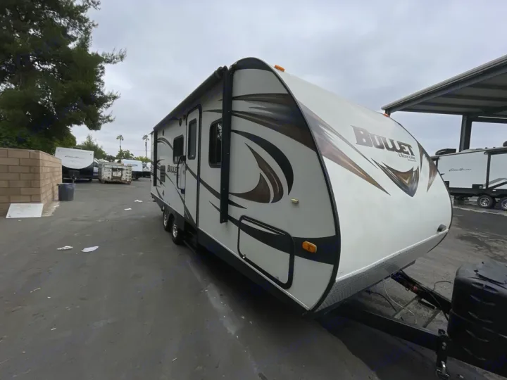 This clean, white Bullet Ultra Lite travel trailer is ready for your RV rental. See this RV parked in an outdoor lot.. Keystone RV Bullet Ultra Lite 2014