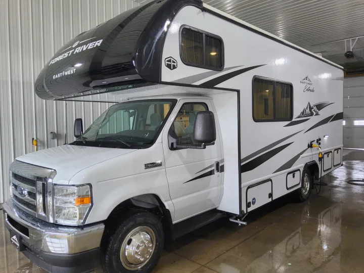 White Forest River East West Entrada Class C RV on Ford E-350 chassis, freshly washed for rv rental.. East To West Entrada 2000NS 2025
