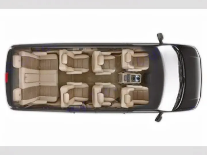 Luxury van RV rental interior: overhead view of spacious, comfortable seating & rear lounge, perfect for travel.. Chevrolet Explorer Luxury Van 9 Passenger 2023