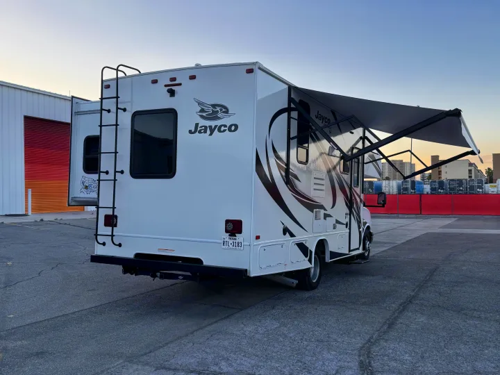 This Jayco rv rental, with its awning out, is parked and ready for your next road trip adventure. Texas plate RTL-3183.. Jayco Redhawk 2021