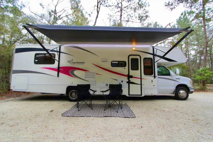 Ready for adventure! This RV rental features an extended awning, outdoor LED lights, camping chairs and an outdoor rug.. Forest River Coachmen Freelander 2011