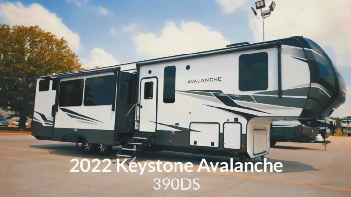 Experience luxury RV rental with this 2022 Keystone Avalanche 390DS fifth wheel camper, parked on a sunny day.. Keystone RV Avalanche 2022