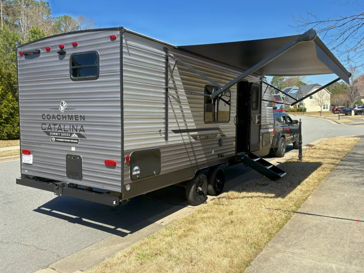 Coachmen Catalina Summit Series travel trailer RV rental, parked with awning extended and steps down.. Coachmen Coachmen Catalina Summit 2025