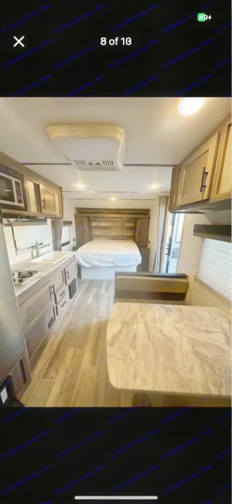 Spacious rv rental interior with a full kitchen, comfy bed, and dining. Perfect for your next adventure.. Gulf Stream Kingsport 2021