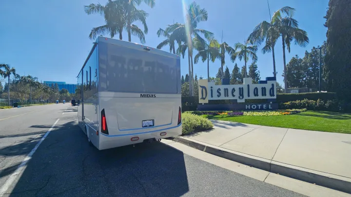 This RV rental, a Midas model, is parked outside the iconic Disneyland Hotel, offering a unique stay near the park.. Tiffin Motorhomes Allegro Midas 24MT 2024