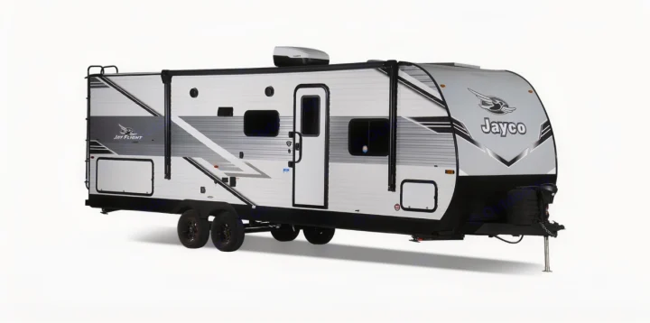 Side view of a white & gray Jayco travel trailer, an excellent option for rv rental. Features include a ladder, awning, and windows.. Jayco Jay Flight 261BHS 2025