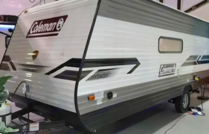 A modern Coleman travel trailer, an excellent RV rental option. This white and grey camper is ideal for adventures.. Dutchmen Coleman Lantern LT 2021