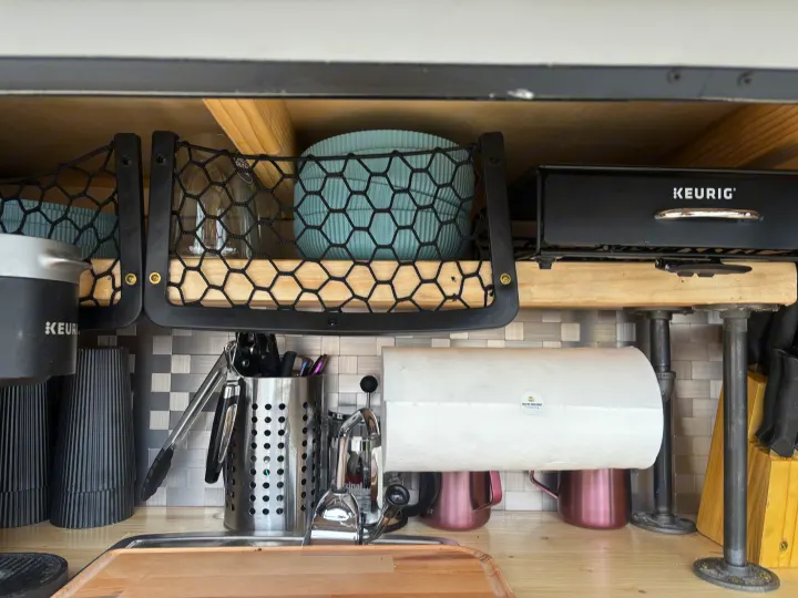 Inside an RV rental: a well-organized galley with Keurig coffee makers, practical storage, and a sink.. Overlander HMDE 2025
