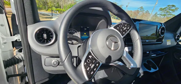 Mercedes-Benz RV rental interior: dashboard with "Start Engine" alert, steering wheel, air vents, and infotainment display.. Mercedes Coleman 24CL 2024
