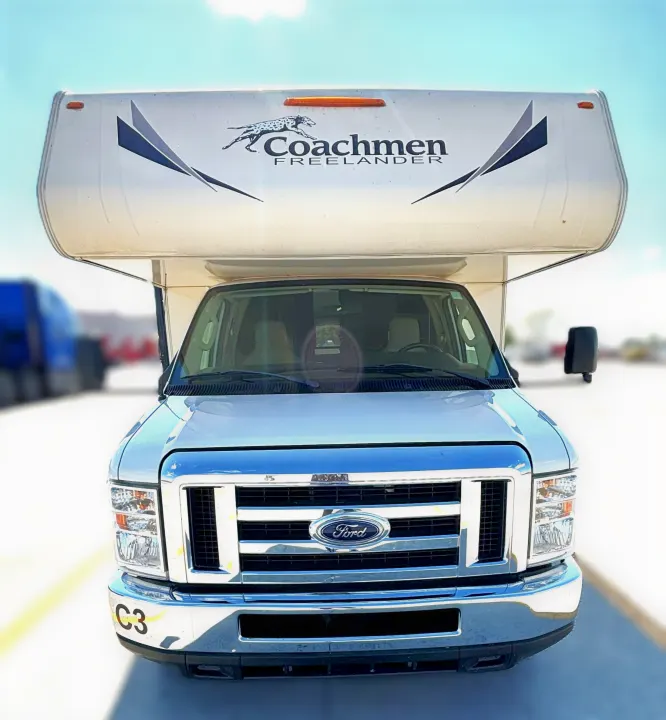 Front view of a white Ford Coachmen Freelander Class C motorhome rv rental. Displays brand name and a cheetah logo.. Coachmen Freelander 2020