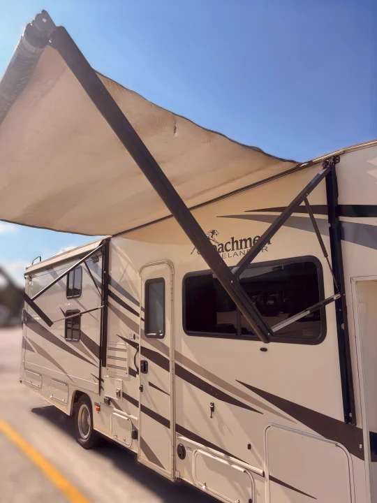 Enjoy your outdoor adventures with this RV rental featuring a large, extended awning providing ample shade for leisure.. Coachmen Freelander 2020