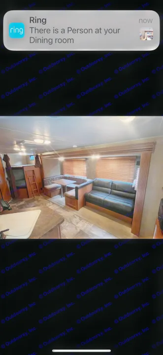 Cozy RV rental interior: dining booth, sofa, and bunk beds. Ring alert indicates a person in the 'dining room'.. Forest River Cherokee 2015