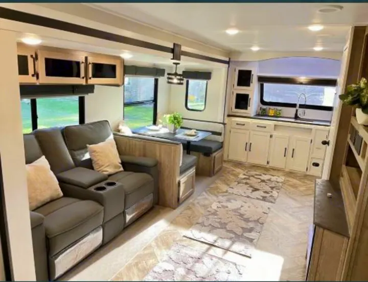 Step inside this modern RV rental! Features include a comfy reclining sofa, dinette, and well-equipped kitchen.. Forest River Palomino Puma 2021