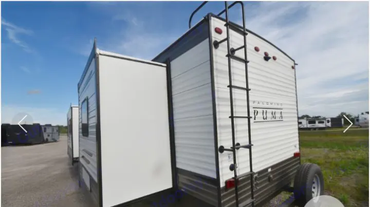 This Palomino Puma travel trailer features an extended slide-out and ladder, showcasing options for an rv rental.. Forest River Palomino Puma 2021