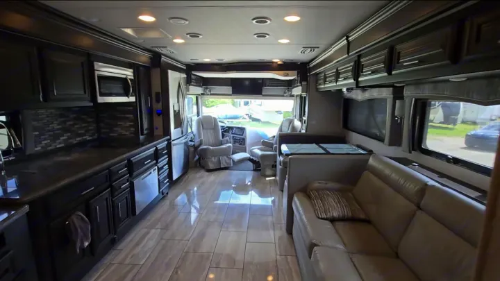 Spacious luxury RV rental interior with kitchen, living area, and cockpit.. Berkshire XL 2022