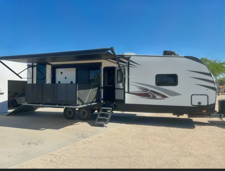 This RV rental features a side deck with awning and ramp, ideal for outdoor living and adventures.. Forest River Nitro Xlr 2017