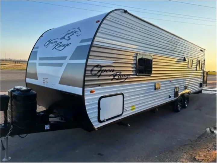 White & grey Open Range travel trailer for your next RV rental. Ready for camping & road trip adventures!. Open Range Open Range 2024