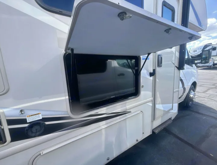Outdoor TV display on an RV rental, ready for your next adventure.. Thor Chateau Sprinter 2018